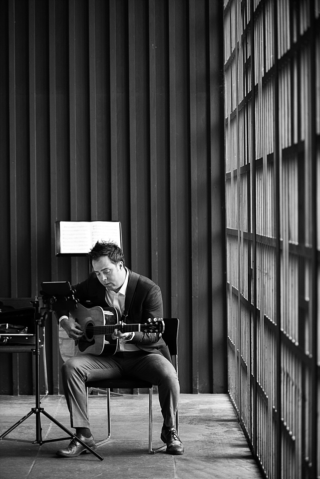 man playing guitar in danforth chapel