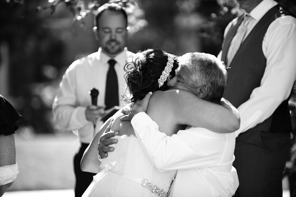 dad hugging bride