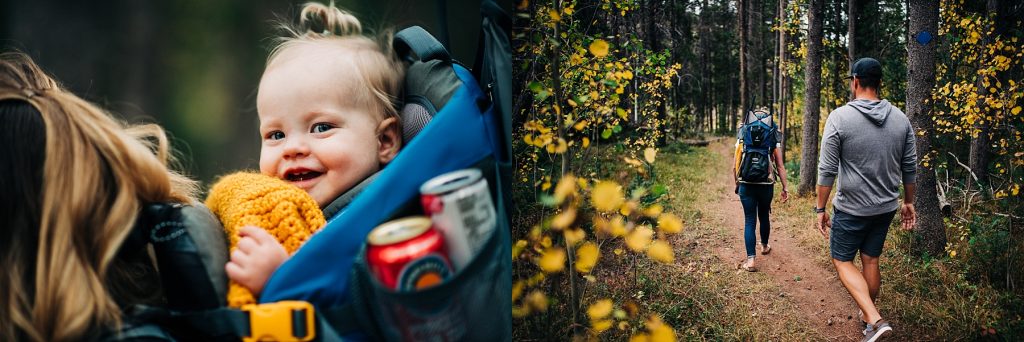 Family hiking through woods with baby in backpack.