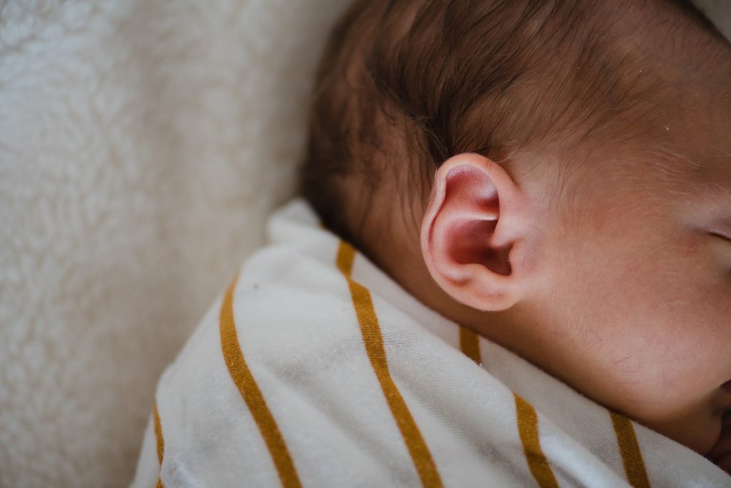 close up of sleeping newborn ear