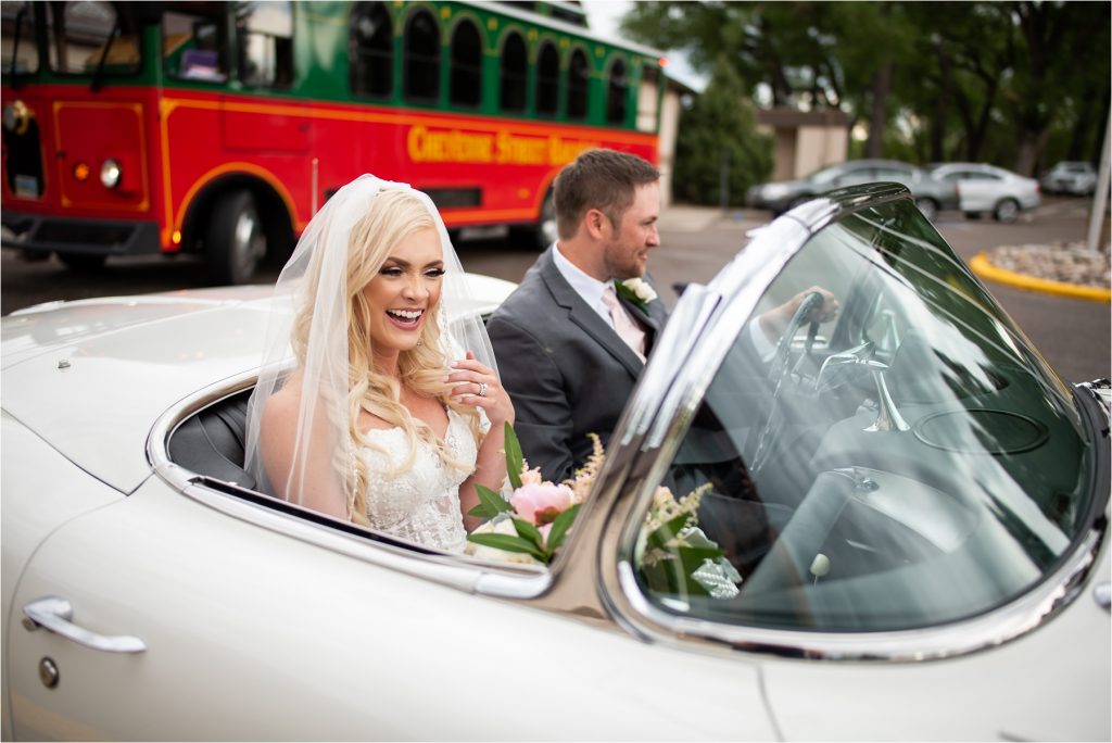 Bride and groom in Corvette.