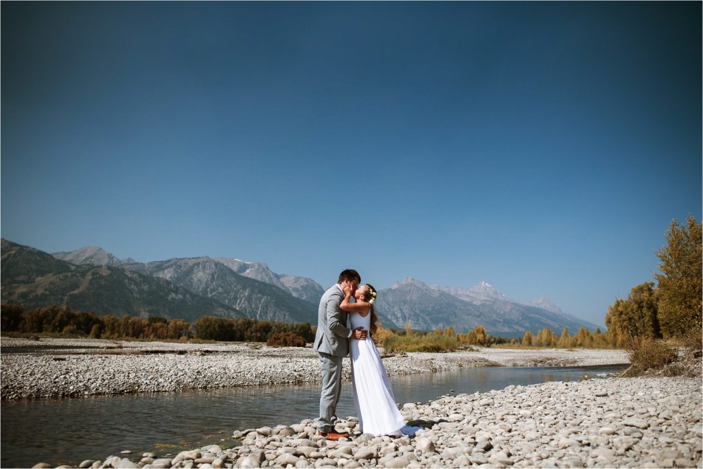 Bride and groom near Snake River.