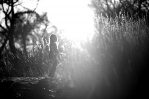 backlit girl and grass
