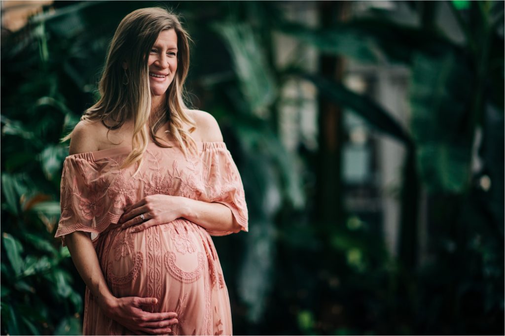 Mom to be laughing during cheyenne botanic gardens maternity session.