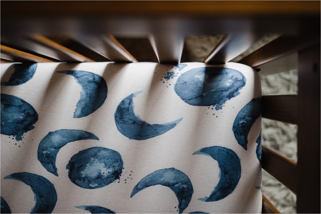 Phases of moon on crib sheets.