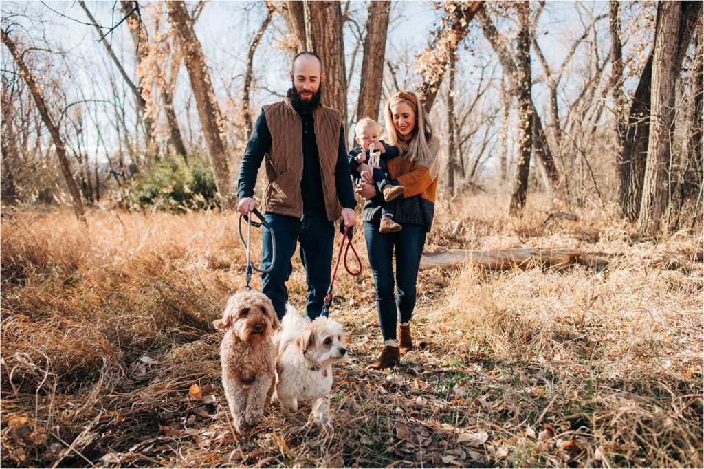 Family walking with dogs in Lee Martinez Park in Fort Collins, Colorado.